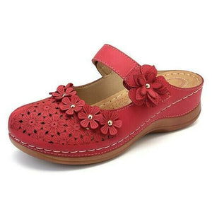 Zapatos de plataforma con flores esculpidas