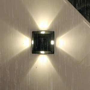 Lámpara de pared solar de plástico de cuatro lados
