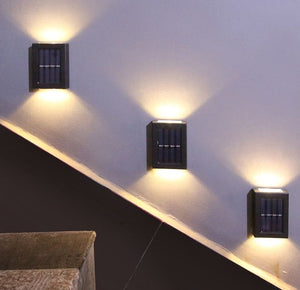Lámpara de pared solar de plástico de cuatro lados